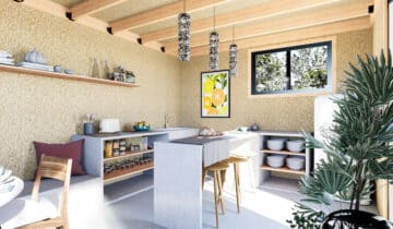 Cuisine moderne dans un studio de jardin avec murs texturés et poutres en bois apparentes