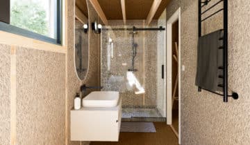Salle de bain moderne avec douche vitrée dans un studio de jardin en bois